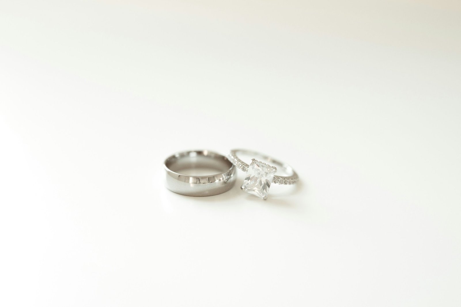 A couple of wedding rings sitting on top of a table